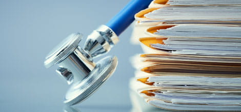 Medical records and stethoscope